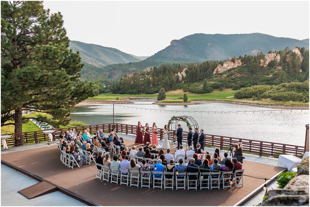 Perry Park Country Club wedding deck during fulling wedding ceremony with lake and mountain view