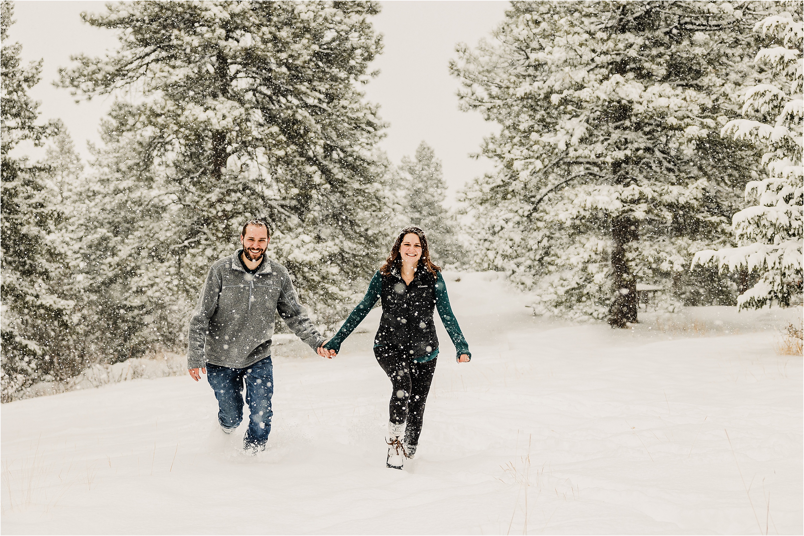 Winter Engagement Photos at Mount Falcon in Colorado. Couple running in snow