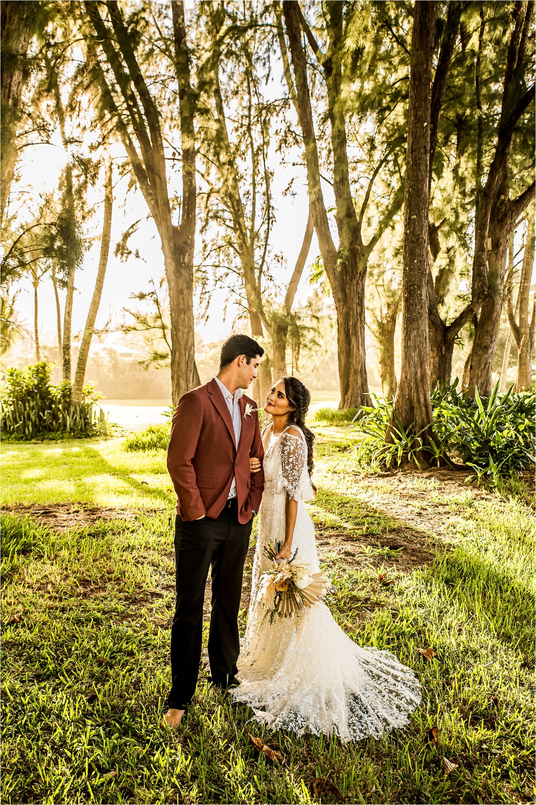 Packages and pricing image of man and woman forehead to forehead in wedding attire with trees in the background