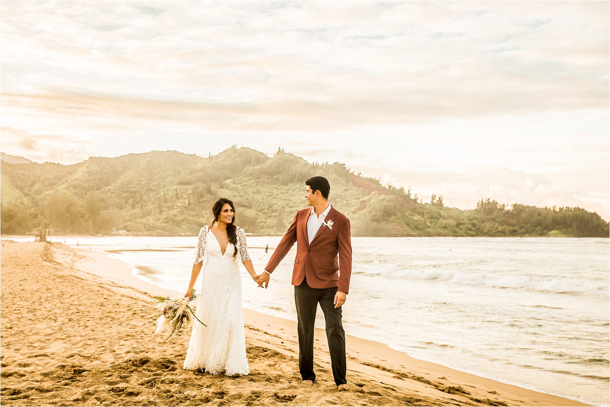 Bride and groom on hanalei bay in Kauai for their elopement